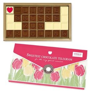 Schoko-Telegramm in einer hübschen Verpackung mit frühlingshaftem Tulpenmotiv –32 Schokotäfelchen mit Botschaft: ♥-liche Grüsse zum Frühling
