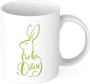 weiße Keramiktasse mit grünem Aufdruck: Frohe Ostern 