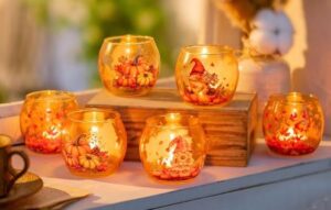 6 bernsteinfarbene Glas-Teelichter mit Herbstmotiven