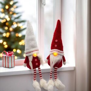 zwei rot/weiße Kantenhocker-Weihnachtswichtel mit leuchtender LED-Nase