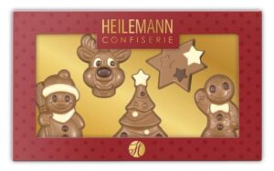 Geschenkpackung mit Weihnachtsfiguren aus dekorierter Vollmilch-Schokolade: Lebkuchenmann, Tannenbaum, Schneemann, Rentier und Stern