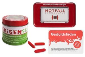 Notfall-Set mit einer Dose Krisenstäben, Notfallschokolade und einer Schachtel Geduldsfäden