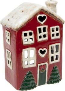 Schöner Keramik-Teelichthalter in Form eines dunkelroten schneebedeckten Hauses.